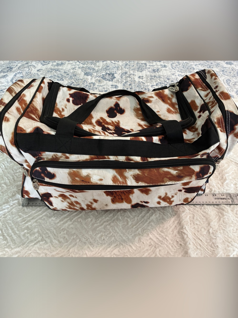 Cowhide-Print Travel Duffel Bag in Brown & White